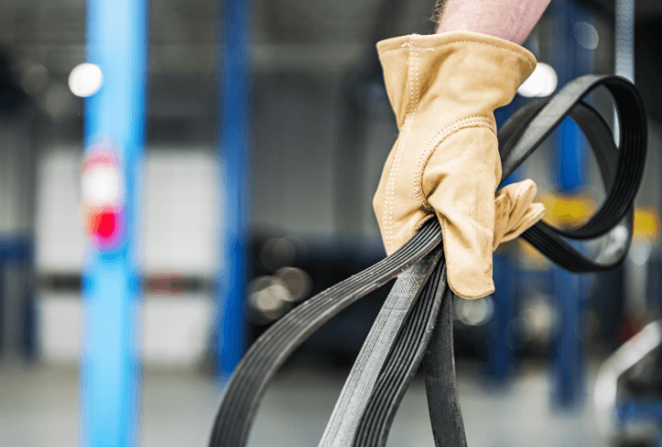 Car mechanic with a brand new serpentine belt