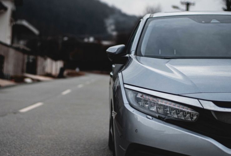 Grey car parked at roadside