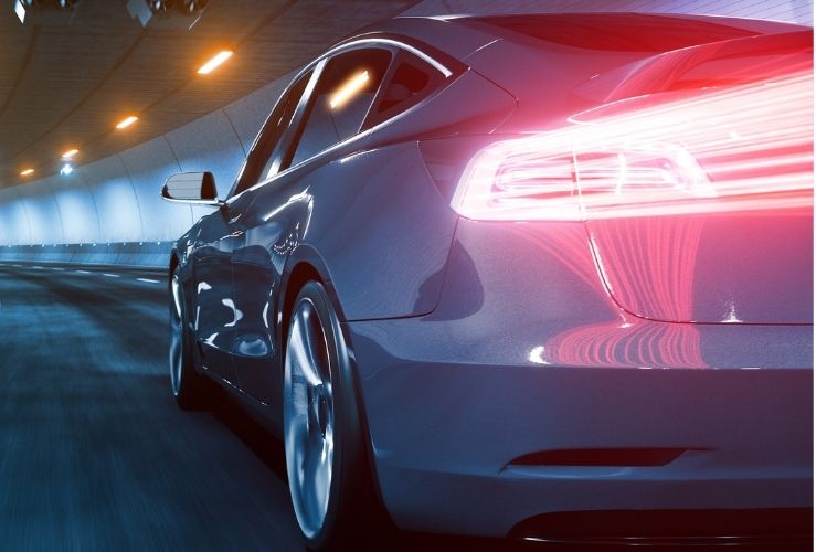 Electric car being driven on motorway through a tunnel