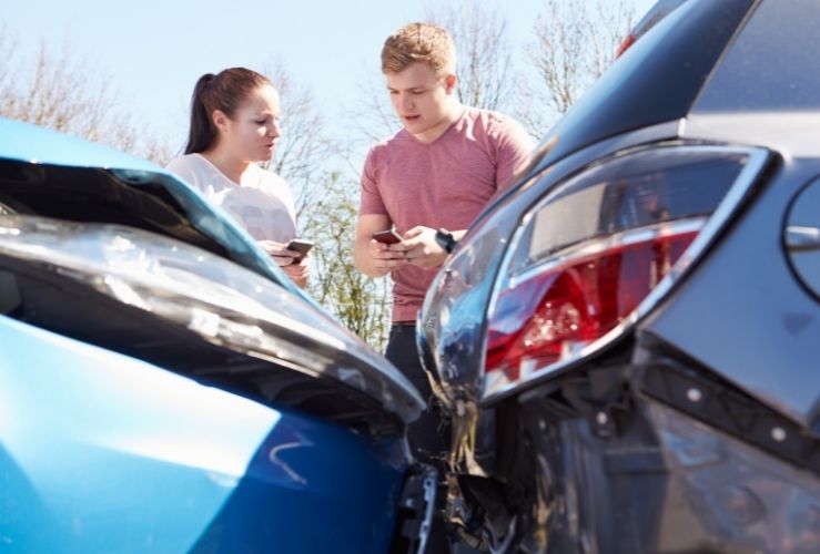 People exchanging details after car crash