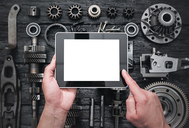 man with tablet over tools