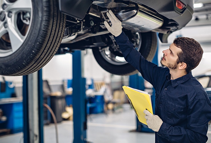 Mechanic under a car 