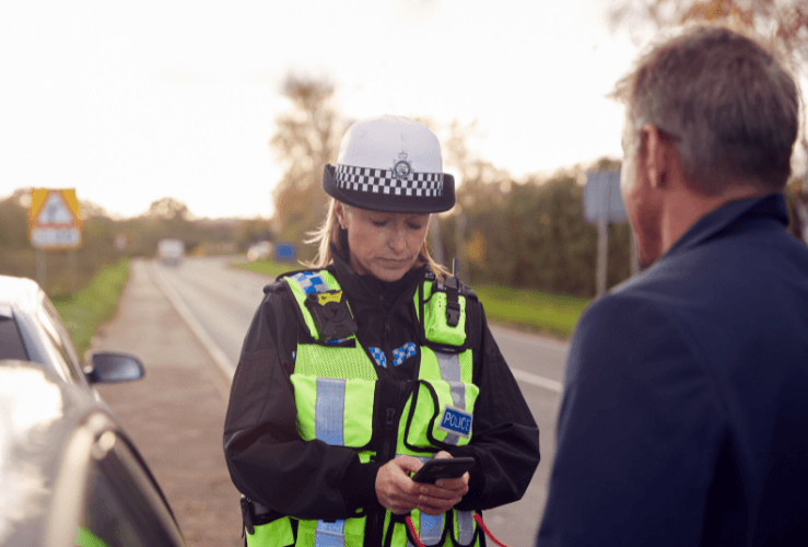 Traffic police officer cautioning driver