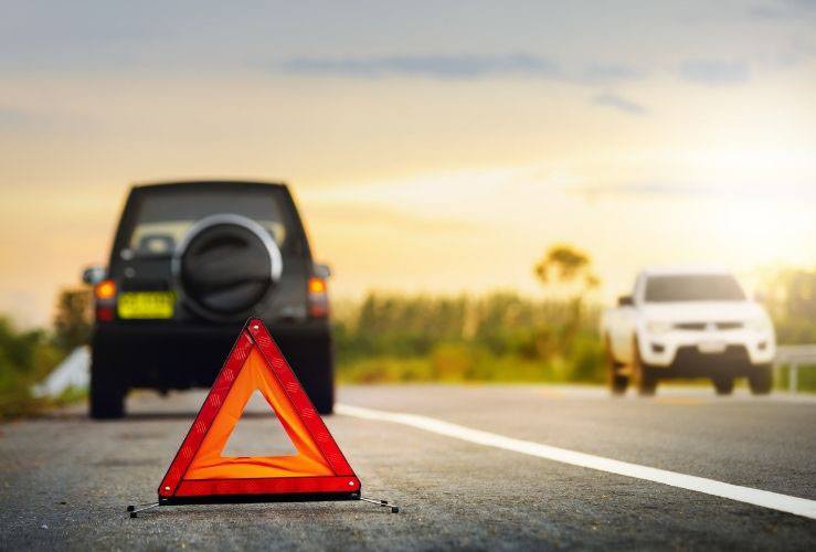 Broken down SUV with warning triangle