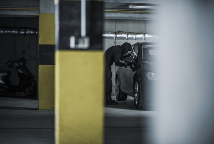 Thief attempting to steal car from car park