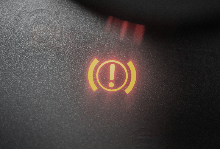 Close up image of handbrake warning light lit up