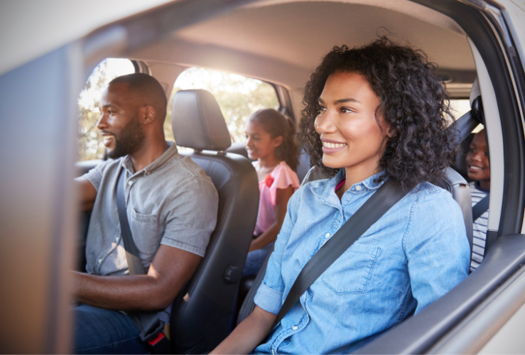 Family in car on long road trip