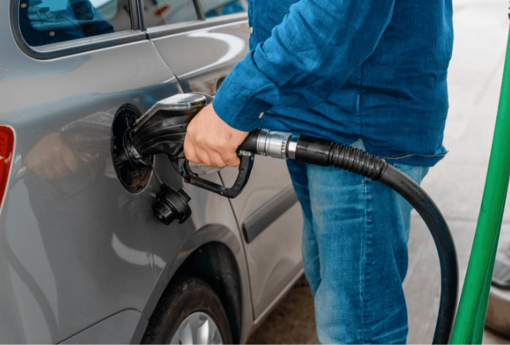 Man fuelling car at petrol station