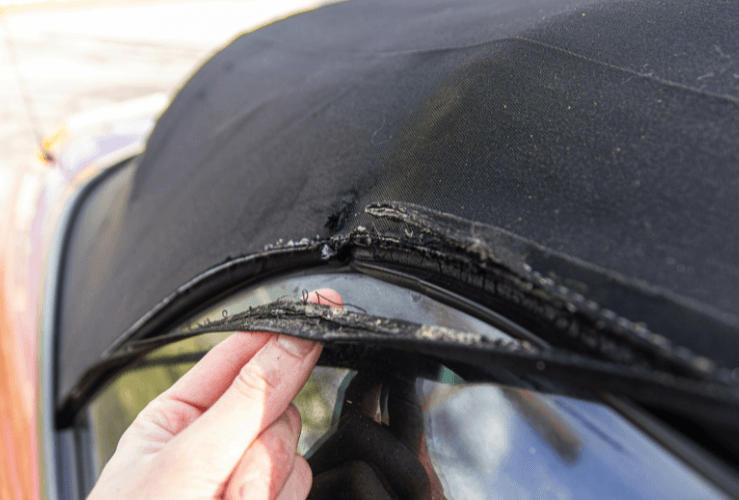 Torn fabric on convertible car roof