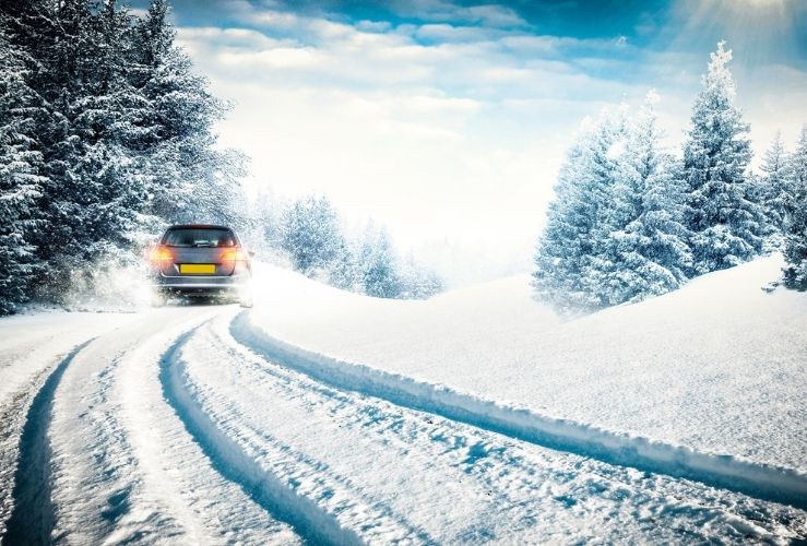 Car driving on snowy road