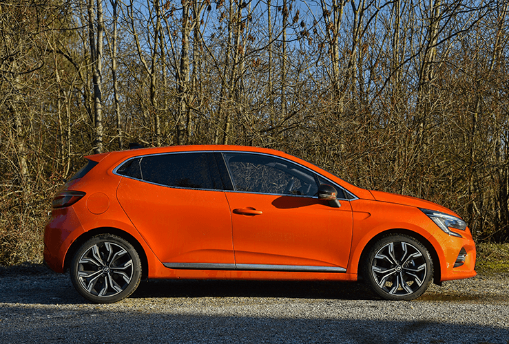 Orange car parked on road