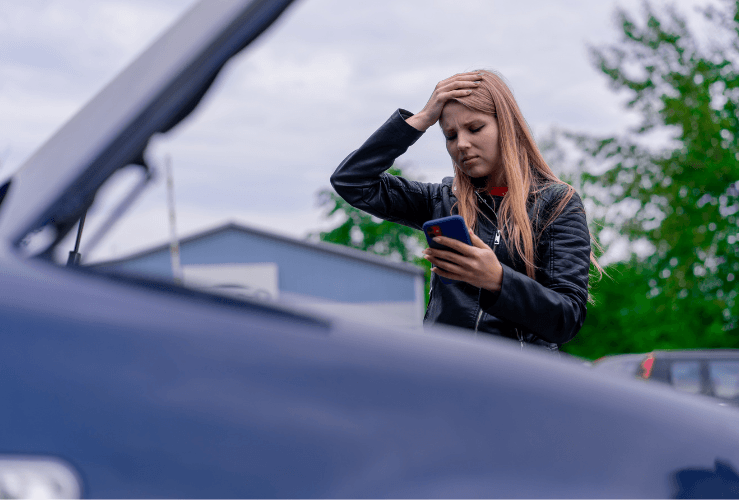 Woman anxious as broken down in car