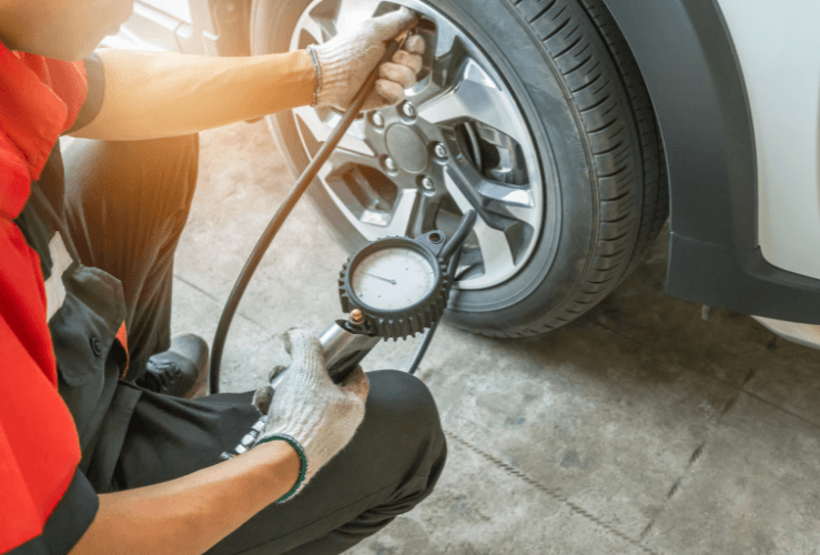 Inflating tyre on business fleet vehicle