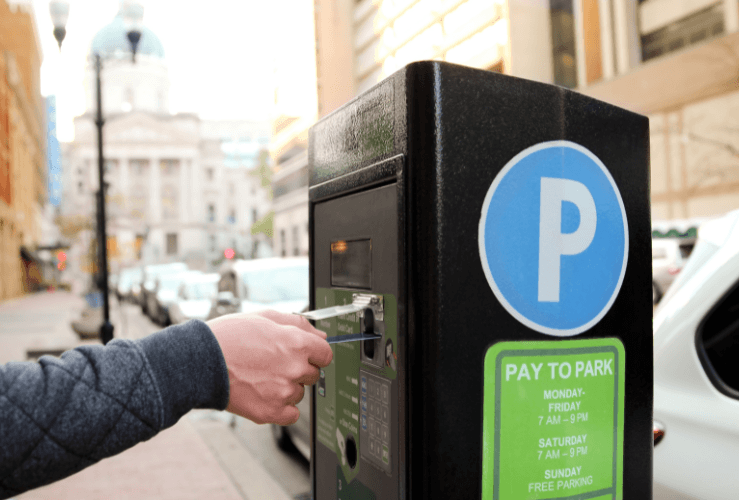 Man using credit card to pay for parking