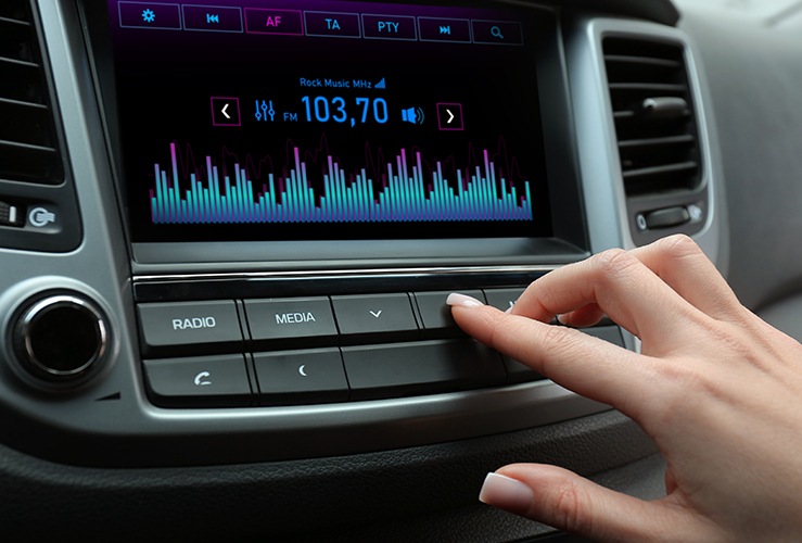 Driver tuning radio station