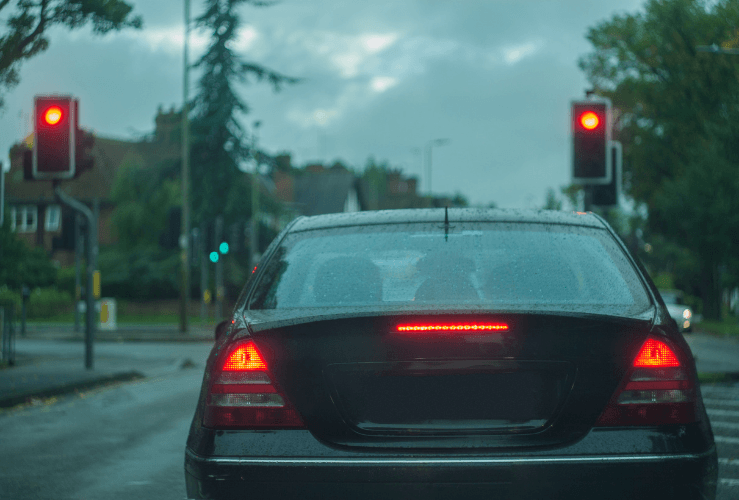 Car stopped at red traffic light