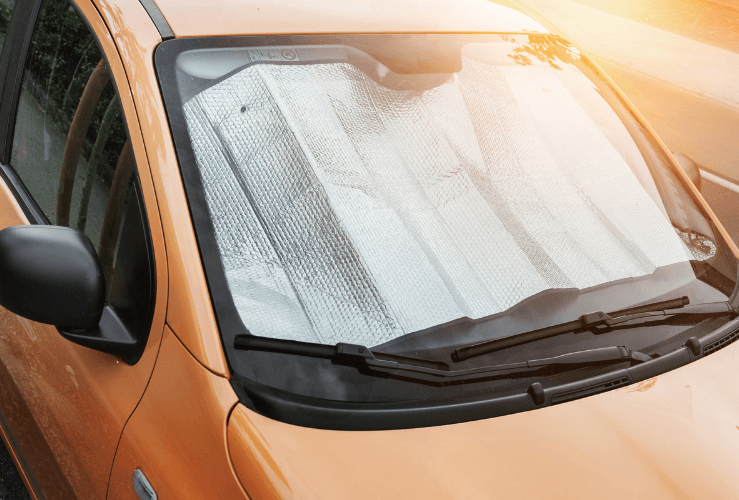 Car with sunshade on front window